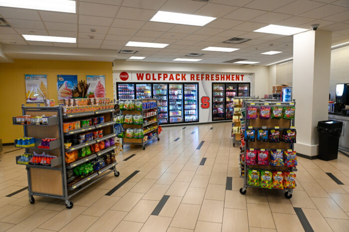 Inside shot of Talley Market showing the new Coke beverage area wrap that says "Wolfpack Refreshment" and the renovated Dole Soft Serve counter.